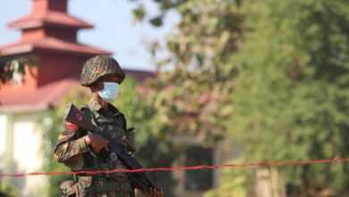 A junta soldier stands guard in Naypyitaw on February 10, 2021 (EPA)