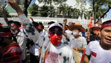 Myanmar workers protesting against the income tax in front of the United Nations office in Bangkok, Thailand, on December 17 (EPA)