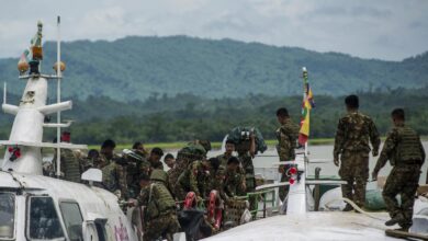Soldiers at Buthidaung port in northern Rakhine State in 2017 (AFP)