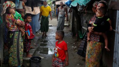In this photo taken in July 2021, members of the internally displaced Rohingya community gather by their makeshift shelters at the Baw Du Pha IDP Camp in Sittwe Township, Rakhine State (Photo: AFP/STR)
