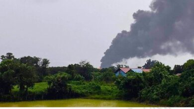 Part of the town of Indaw burns after an arson attack by junta forces in July 2022