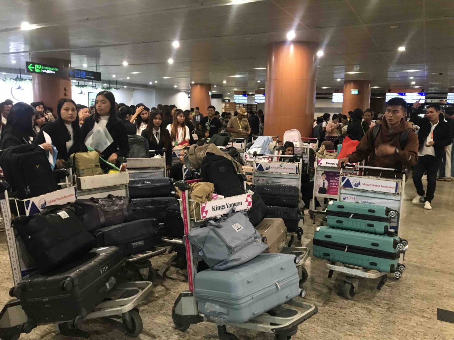 Myanmar nationals wait for permission to leave the country from Yangon International Airport in early August (Supplied)