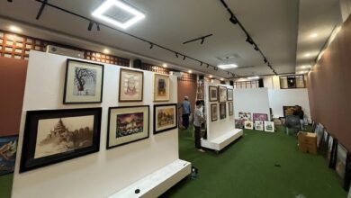 Artwork being hung and prepared for the “Phoenix Mandalay” exhibition on May 21 (Photo: Nanmati Art Gallery)