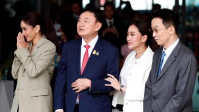 Former Thai prime minister Thaksin Shinawatra (second from left) is flanked by his children at Bangkok’s Don Mueang airport soon after his return to Thailand in August 2023 (EPA)