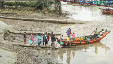 Yangon residents boarding a boat to reach their homes across the river in July 2024 (Myanmar Now)
