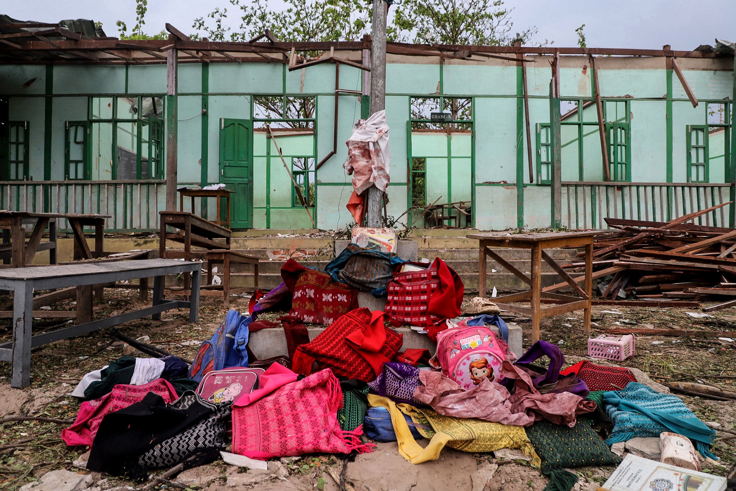 Students' bags are kept in front of a school building damaged in a bombardment carried out by Myanmar's military at the Ohe Htein Twin village in Tabayin township, Sagaing Region, on May 12, 2025. (Photo: AFP)