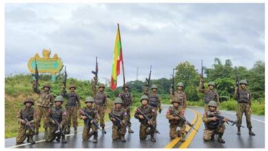 Junta forces pose on a section of the Kyondoe-Kawkareik road in Karen State (Junta-controlled state media)