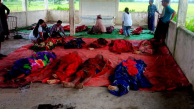 A group of victims is seen after a junta airstrike on a high school in Kyauktaw Township, Rakhine State, killed at least 18 people when warplanes dropped heavy bombs on a civilian area. (Photo: Arakan Princess Media / APM )