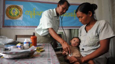 A doctor checks a Rakhine child at a monastery used as a temporary shelter for people displaced by days of violence in Sittwe, capital of the western state of Rakhine on June 14, 2012. (Photo: AFP)