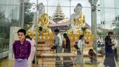 Buddhist devotees visit Botataung Pagoda during the full moon day of Waso, a sacred day in the Myanmar lunar calendar that marks the beginning of Buddhist Lent, in Yangon in July 2025 (Sai Aung Main / AFP)