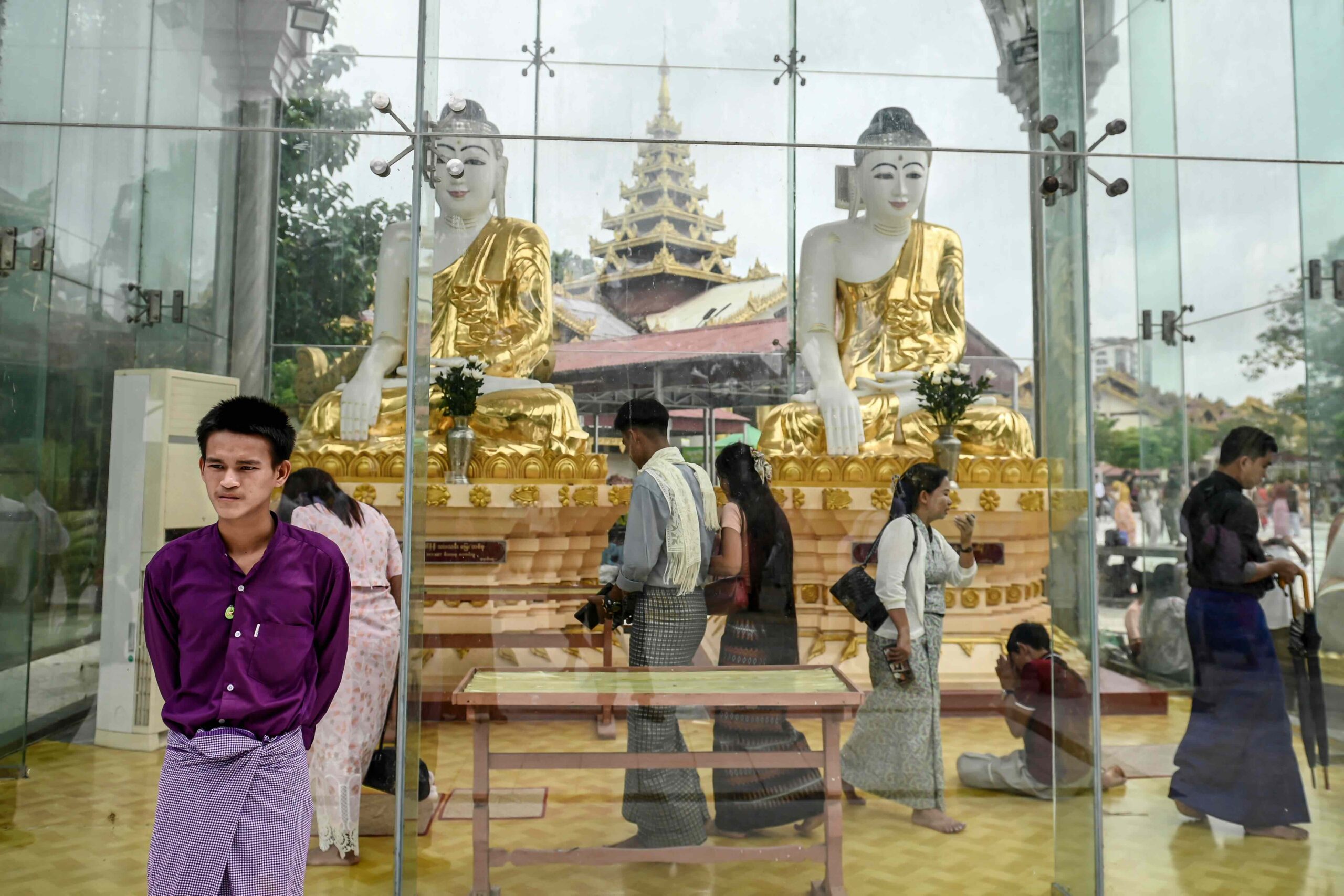 Buddhist devotees visit Botataung Pagoda during the full moon day of Waso, a sacred day in the Myanmar lunar calendar that marks the beginning of Buddhist Lent, in Yangon in July 2025 (Sai Aung Main / AFP)