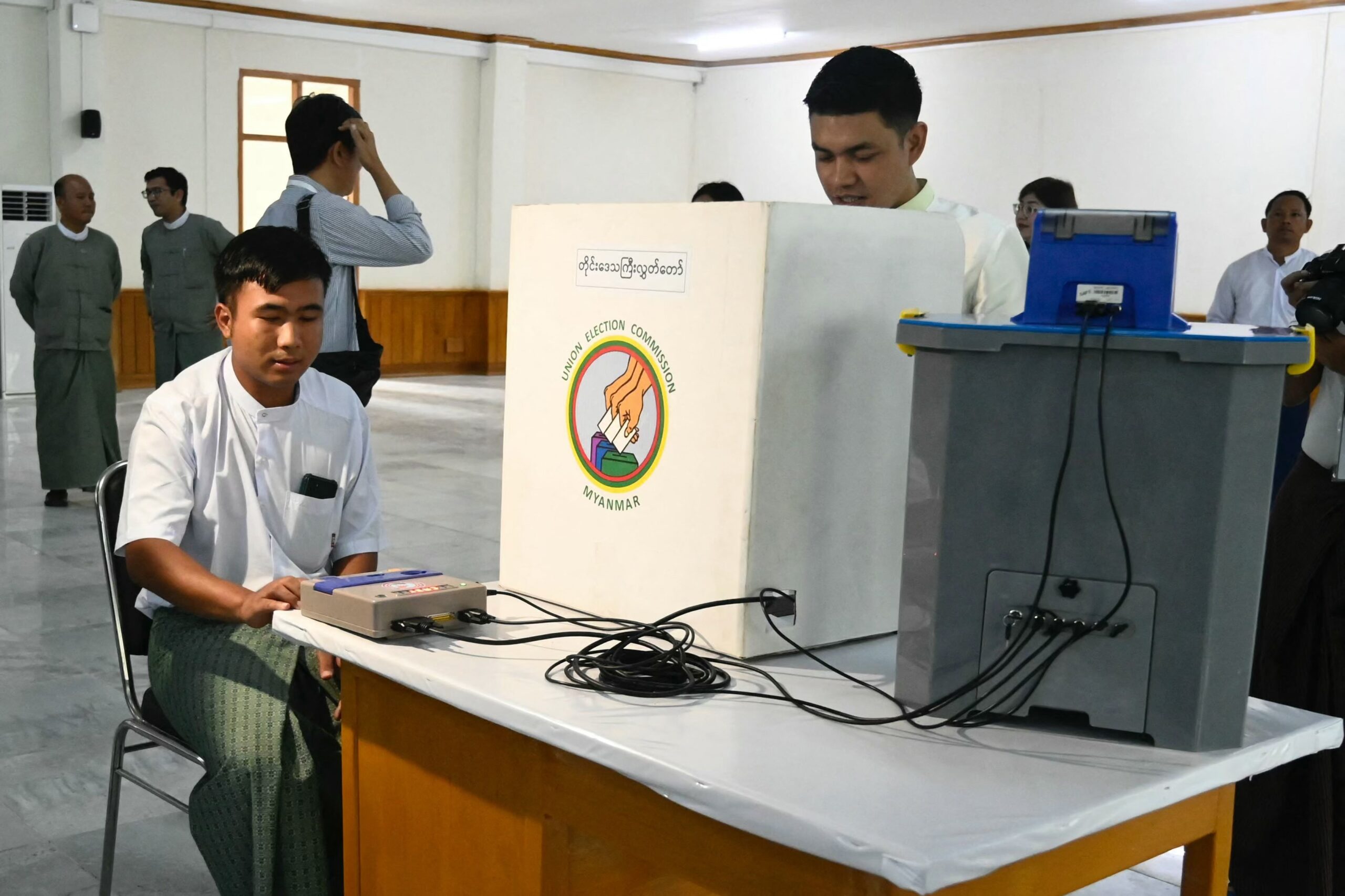 A man tests a voting machine during a press conference held by the Union Election Commission in Naypyitaw on September 11 (Photo: AFP)
