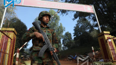 A TNLA fighter stands guard in Namtu, northern Shan State, after the group seized control of the town on December 28, 2023. (Myat Pan / Myanmar Now)