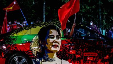 NLD supporters wave flags and celebrate in front of the party office in Mandalay as results come in during the November 2020 general election (Photo: AFP)