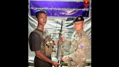 A photograph released by the Karen National Union's Black Panther Column on October 7, 2025, shows a junta army member with KNU’s Major Da Baw. (Photo: KNU)