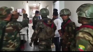 The Karen Border Guard Force troops take part in a junta-led raid on the Shwe Kokko enclave in Myawaddy Township, where authorities say hundreds of foreign nationals and large volumes of scam equipment were seized. (Photo: Screenshot from junta-released press video)