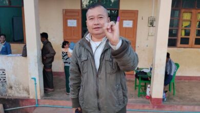 A man holds a pistol outside a polling station in Hpapun Township, Karen State, on January 11 (Photo: Supplied)