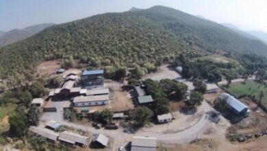 An aerial view of buildings and excavation sites in Mandalay’s Phayaung Taung gold mining block, showing extensive land clearing and mining infrastructure (Photo: 2023 Department of Mining report)