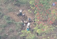 A drone captured footage of the junta forcing civilians to dig graves to bury the dead in Yae Twin Kone, a village tract in eastern Bago Region that the army occupied for three consecutive days, holding the civilian inhabitants hostage (Still image: KNU)