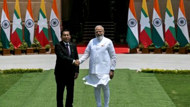 India’s Prime Minister Narendra Modi, right, shakes hands with Myanmar dictator Min Aung Hlaing in New Delhi on June 1 (Photo: Arun Sankar / AFP)