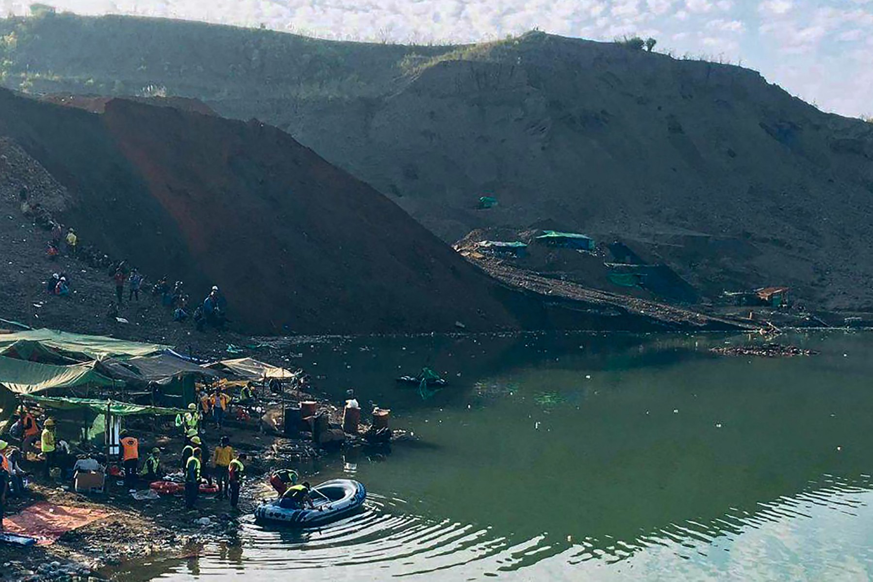 Rescue workers prepare to search for missing people after a landslide at a jade mine in Hpakant in December 2021 (Photo: AFP)