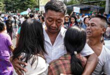A former prisoner is embraced by his family following his release (Photo: Lucky)