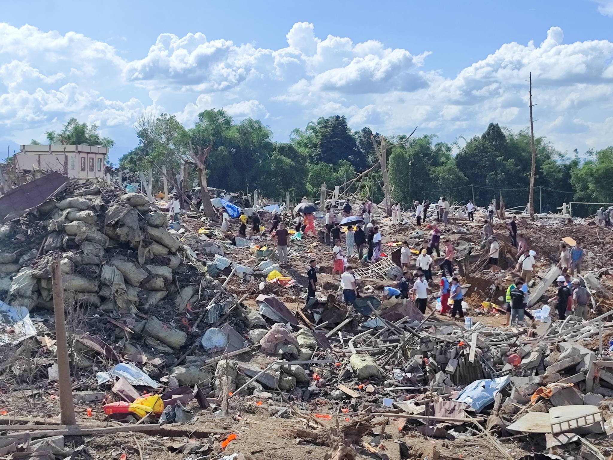 Residents and rescue workers comb the wreckage of the massive blast that killed at least 39 people in northern Shan State’s Namkham Township on May 31 (Photo: Palaung Land)