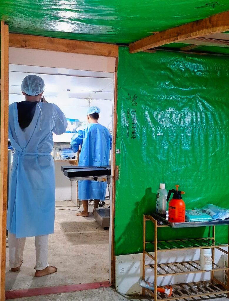  Dr. Drit and Dr. Min ready the operating room for expected casualties (Photo: Phil Thornton) 
