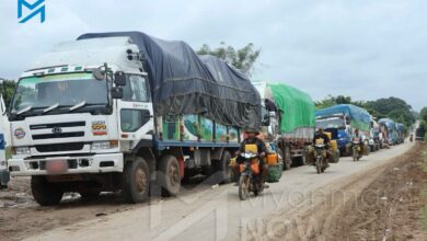 Trucks are forced to park along a section of the Shwebo-Myitkyina highway in Sagaing Region due to clashes in August 2025 (Photo: Moe Oo / Myanmar Now)