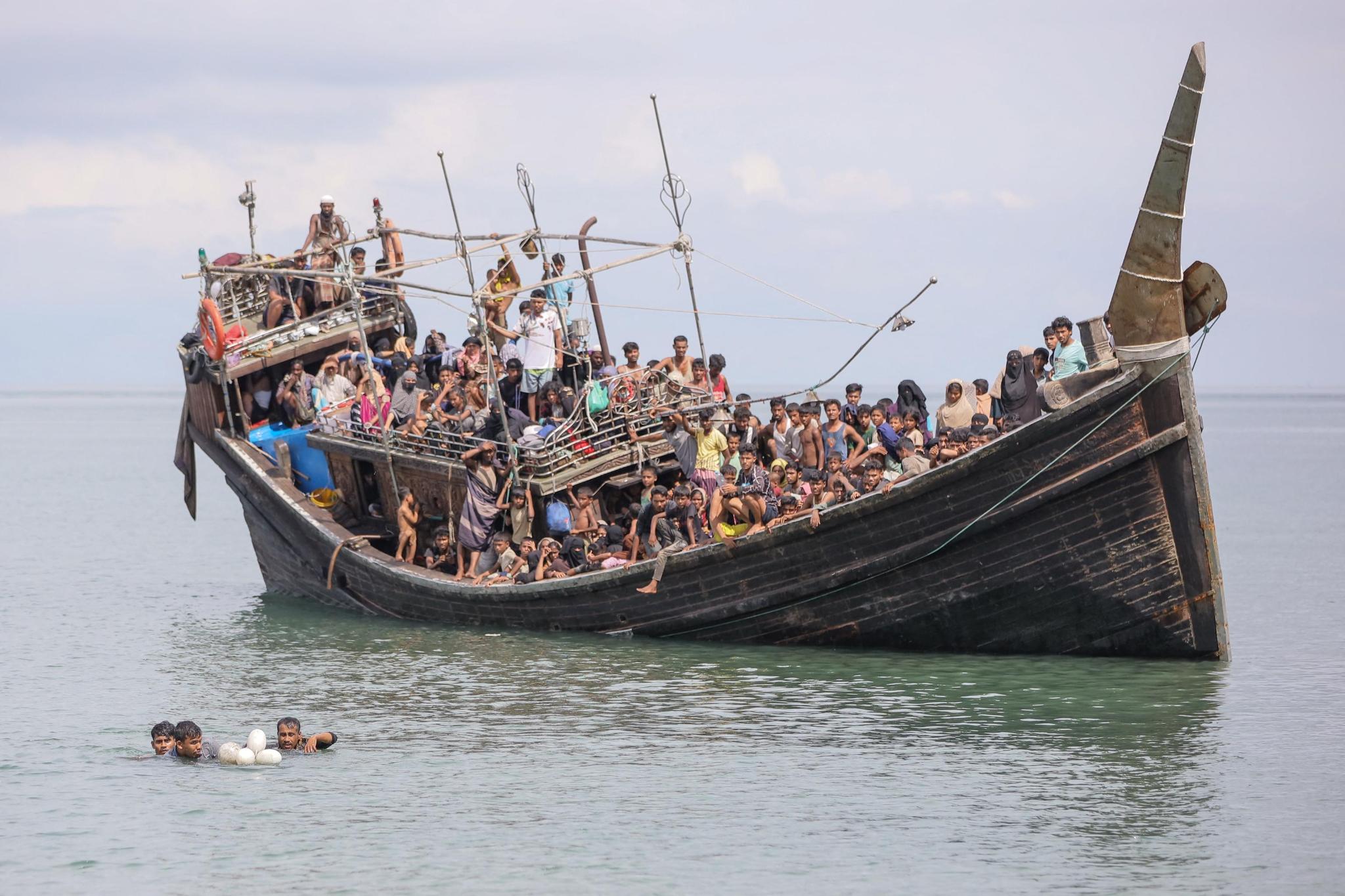 A boat carrying Rohingya refugees is stranded after reaching the coast of Indonesia’s Aceh Province in November 2023 (Photo: Amanda Jufrian / AFP)