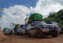 Vehicles carry goods along the road from Namhkam to Lwegel on the Chinese border (Photo: Supplied)