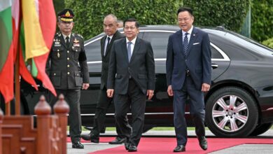 Myanmar junta leader Min Aung Hlaing is welcomed by Thailand's Prime Minister Anutin Charnvirakul at Government House in Bangkok during his visit to Thailand on August 6, 2026. (Photo: Lillian Suwanrumpha/AFP)