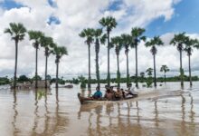 Locals use boats to travel through an area inundated by heavy rains and rising river waters in Wetlet Township, Sagaing Region, on August 10 (Photo: AFP)