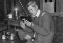 My grandfather, listening to his radio by candlelight (Photo: Myo Thant)