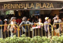 Visitors outside Singapore’s Peninsula Plaza during August 2026 (Photo: Aung Naing/Myanmar Now)