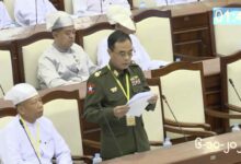 A screenshot from junta-controlled state television shows Maj.-Gen. Min Thu, the regime’s deputy home affairs minister, addressing parliament in Naypyitaw on October 6